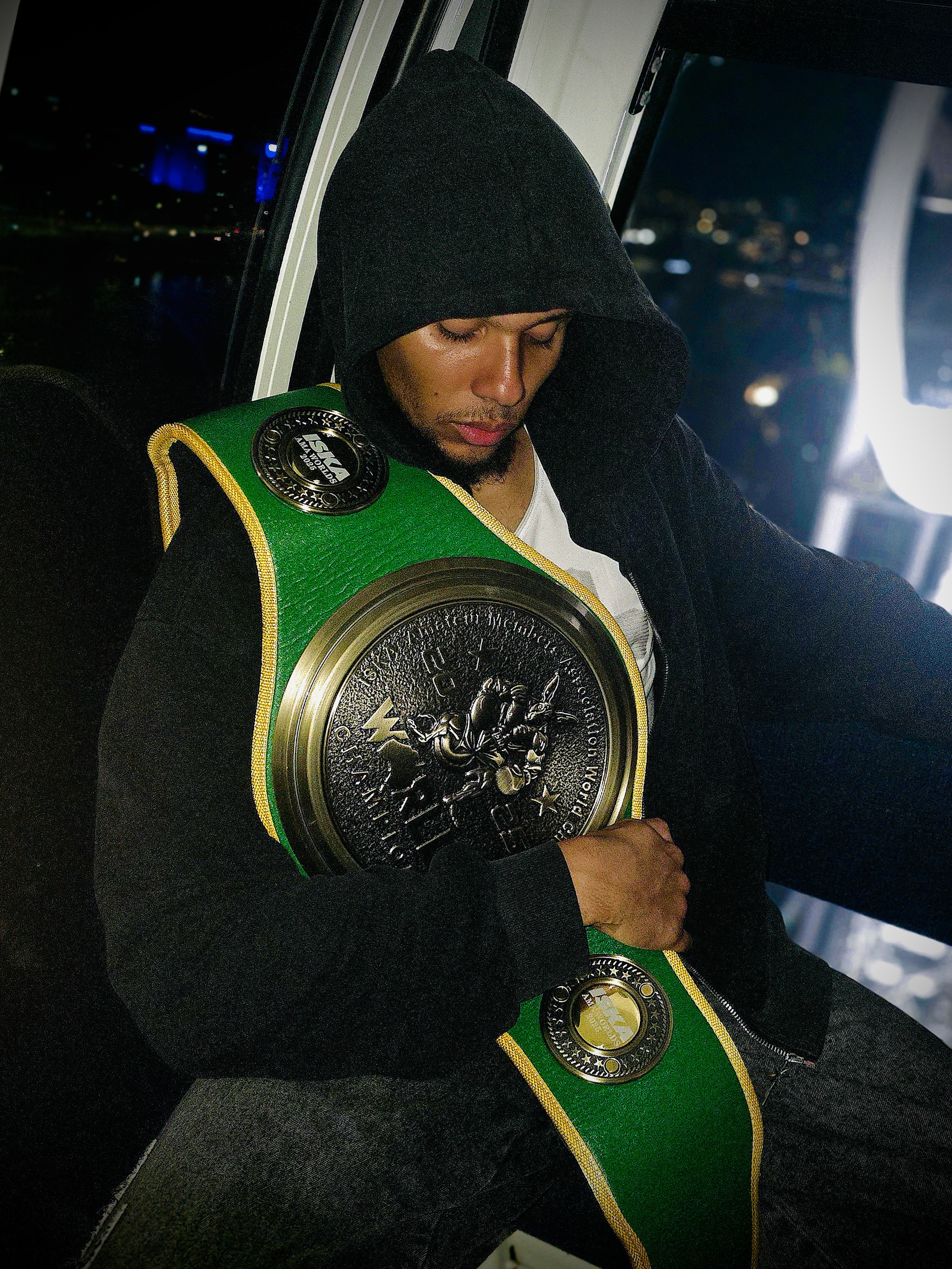 Josh Thomas with championship belts